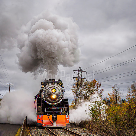 Portland's Holiday Express steams up upon departure.