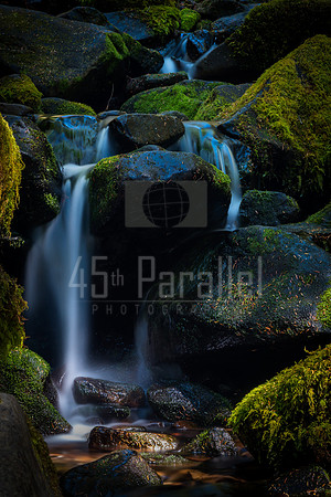 A Small Cascade Over Mossy Rocks