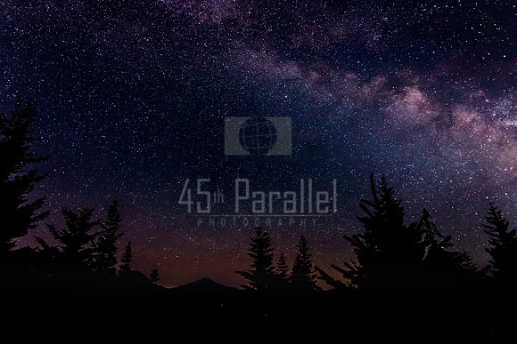 Mt. Jefferson stands silhouetted against a field of stars.