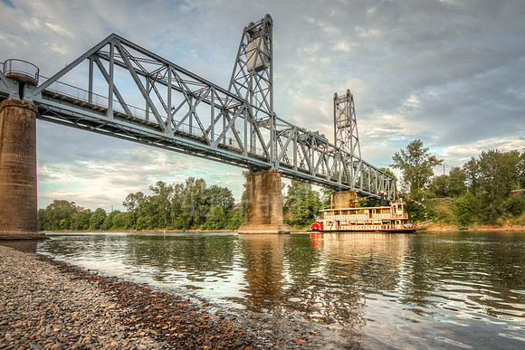 Salem's Willamette Queen riverboat cruises home under the Union Street Bridge.